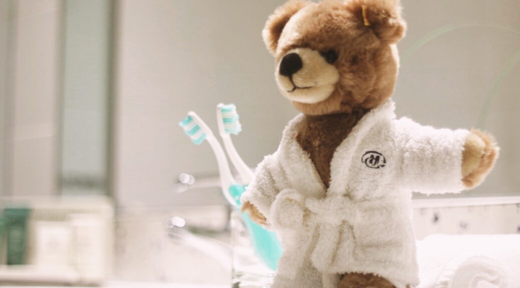 Brown teddy bear in a bathroom in a Hilton hotel, Sofia